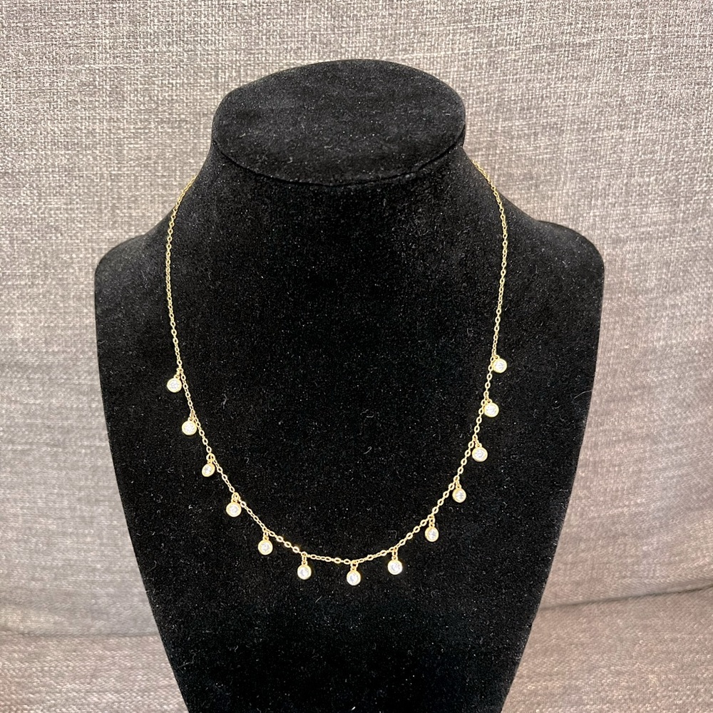 Gold tone necklace with Diamond like embezzled detail